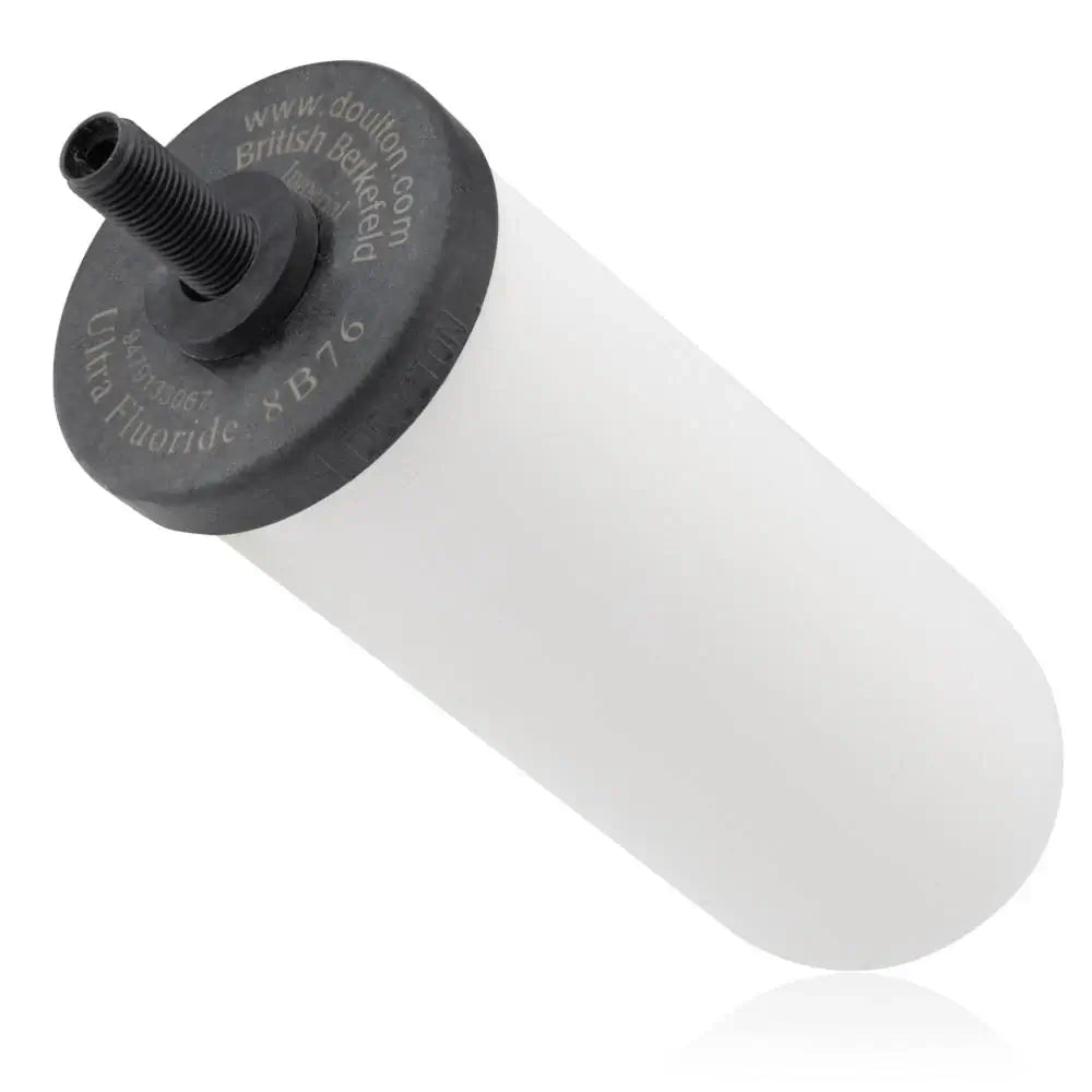 A Doulton British Berkefeld ceramic water filter candle, designed in a cylindrical shape with a white body and featuring a black end cap with a threaded connector, available in 5.75