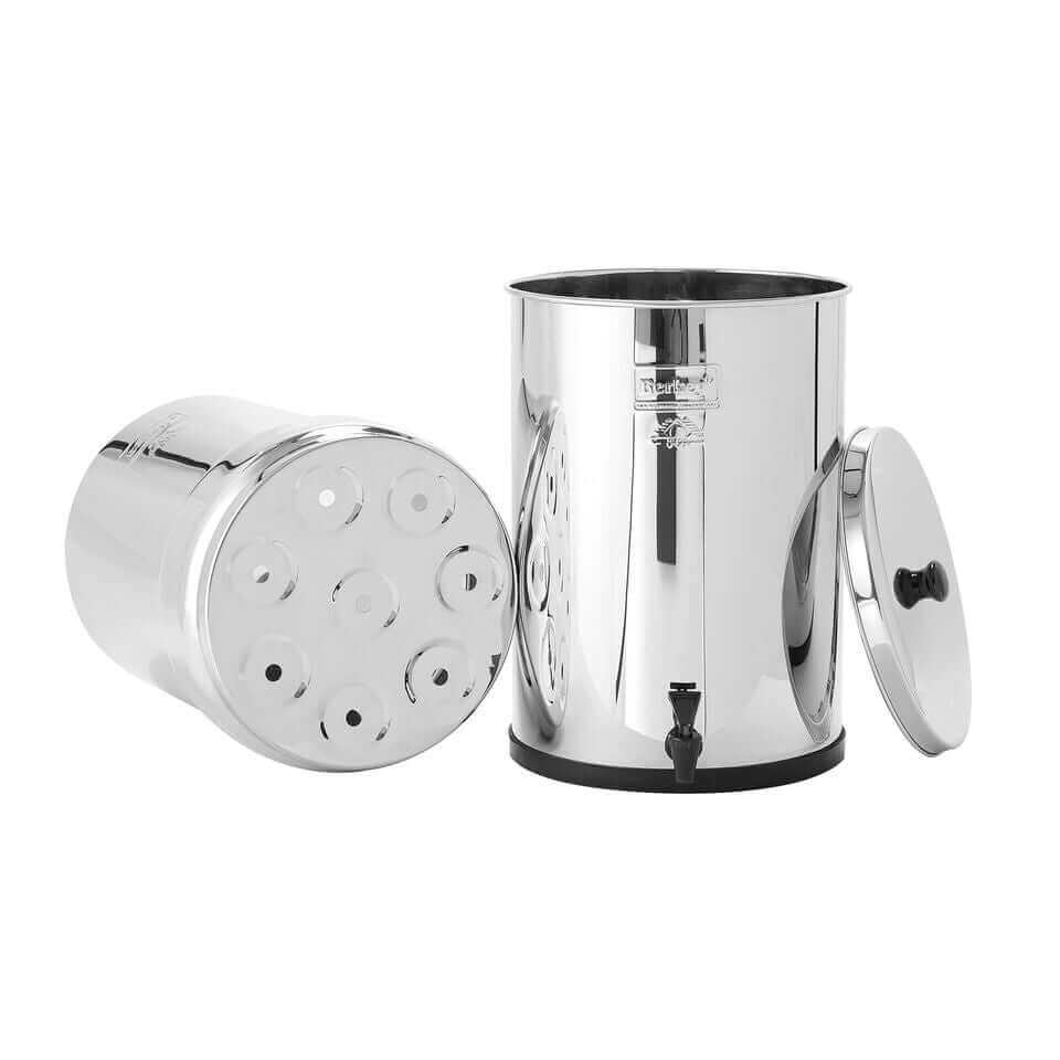 Top and bottom tanks of Crown Berkey System water purifiers (6 gal), one standing upright and the other lying on its side, come with shiny metal designs and lid.