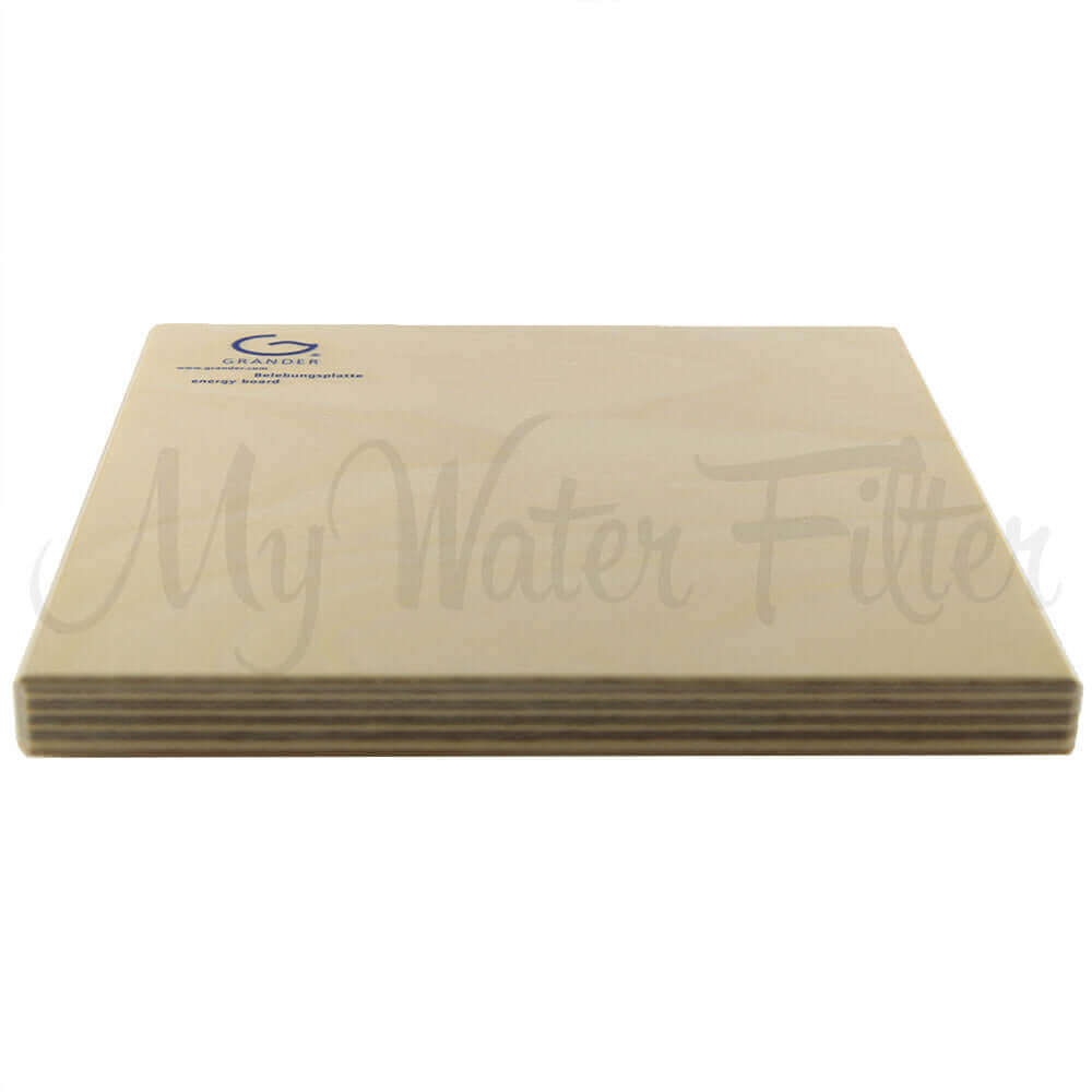 A side view of a beige wooden Grander filter featuring the Grander Revitalising Board logo