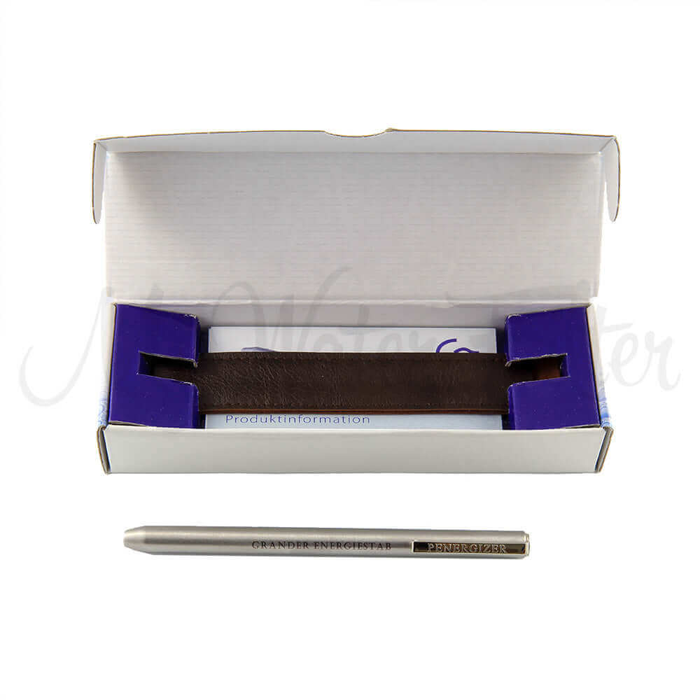 Grander Penergizer's silver pen with engraving sits beside an open box containing a leather slip
