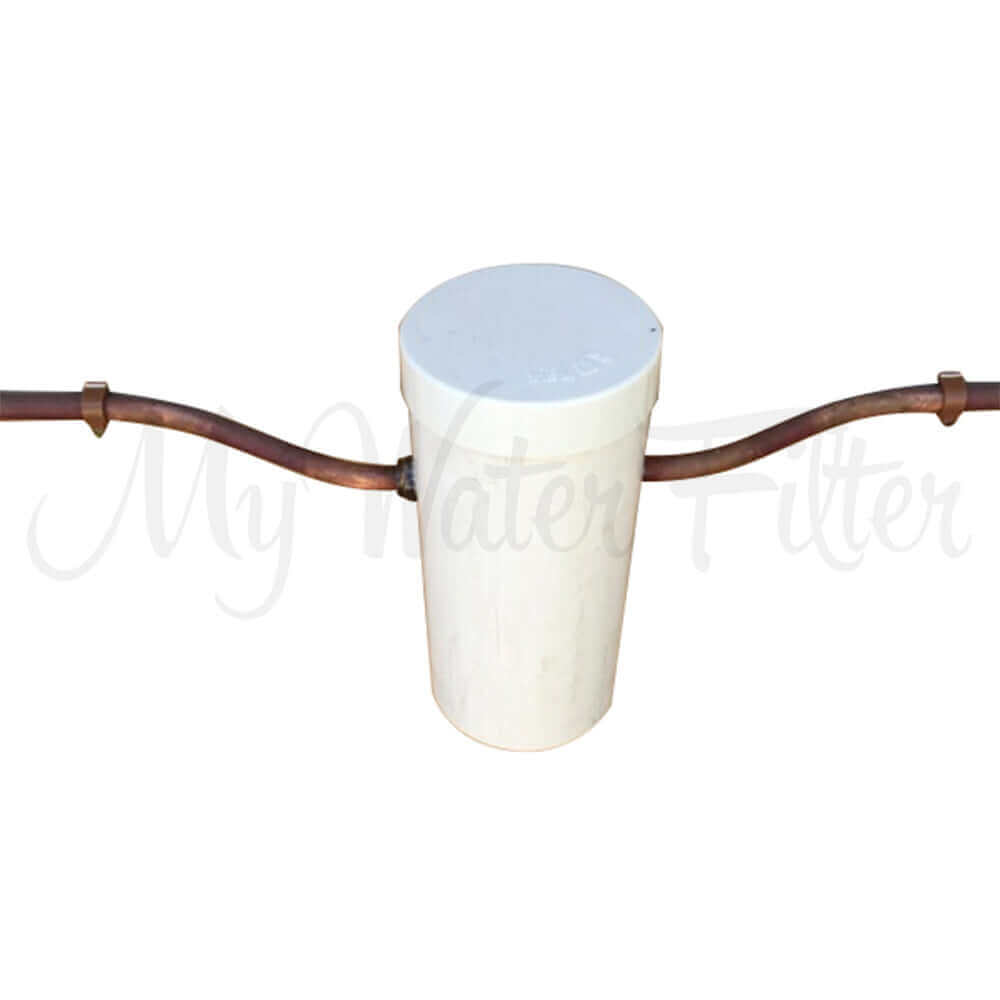 A cover to protect Grander Whole House Systeme with copper pipes on both sides.