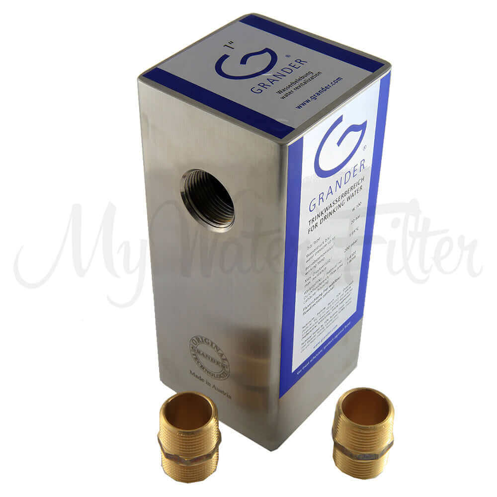 A Grander Whole House System metal water unit with two brass fittings.
