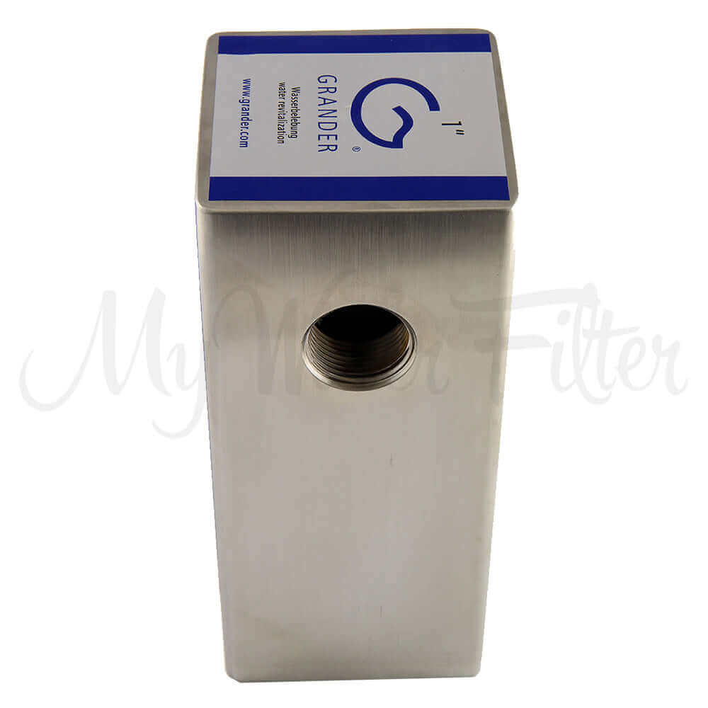 Rectangular metallic Grander water filter with a threaded opening and Grander Whole House System blue branding on top.