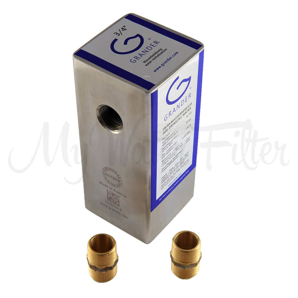 The Grander Whole House System is a stainless steel water filter device featuring a blue label and two brass fittings at the bottom.