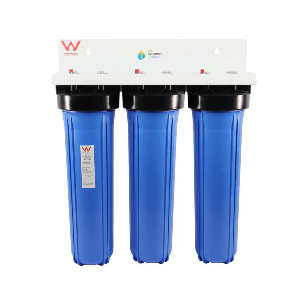 The HPF 20" x 4.5" Triple Big Blue Whole House Chloramine Reduction Water Filter System featuring a white bracket with WaterMark logo and three blue housings with black head caps.