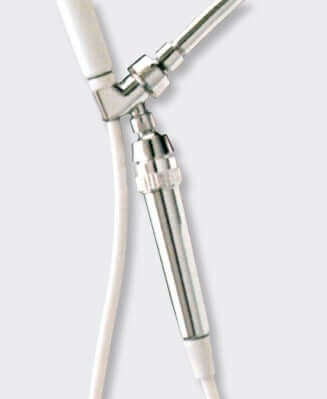 Close-up of a Sprite Hose Shower Filter in chrome, with attached white tubing.