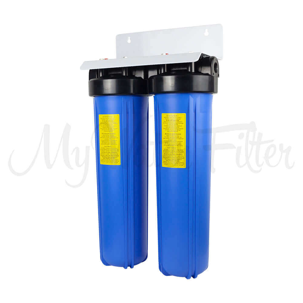Two MWF 20" x 4.5" Twin Big Blue Whole House Rain Water Tank Water Filter canisters from My Water Filter are mounted on a white wall bracket, integrating seamlessly with an Aragon Filter System for efficient purification.