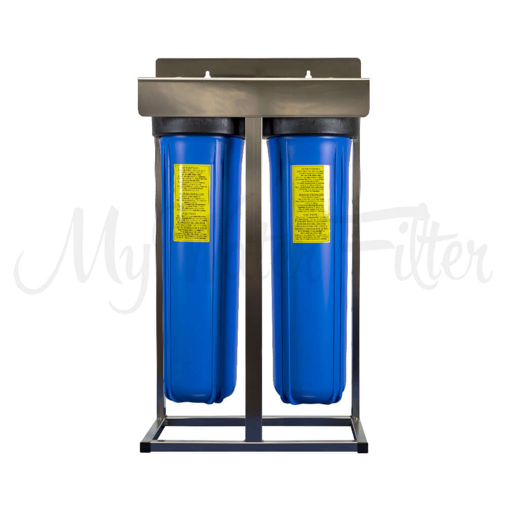 MWF, features a 20" x 4.5" Twin Big Blue Whole House Water Filter System on a stainless steel frame with yellow labels.