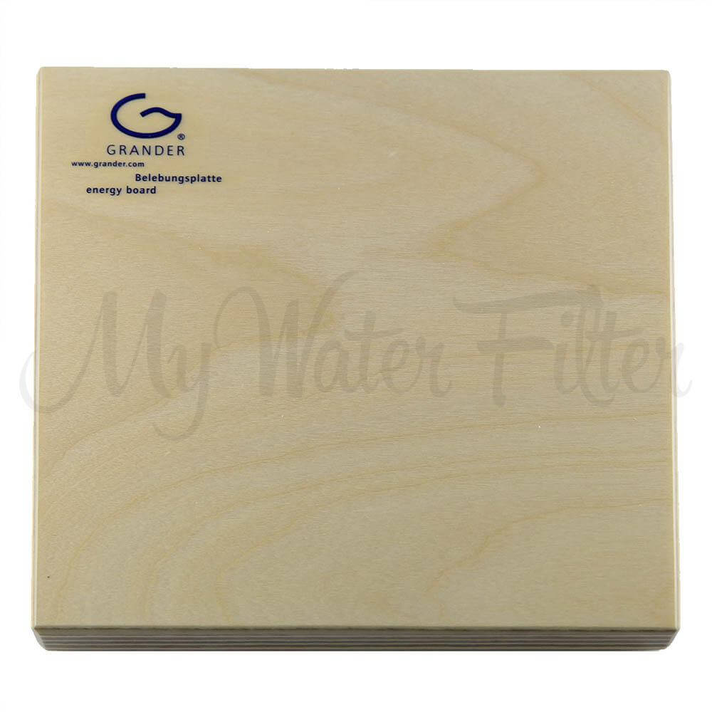 A wooden board featuring the "Filteroo" logo and "Joey 12L Gravity Ceramic Water Filter with Grander Revitalised Structured Water" text on the top left corner highlights its association with Grander revitalised water.