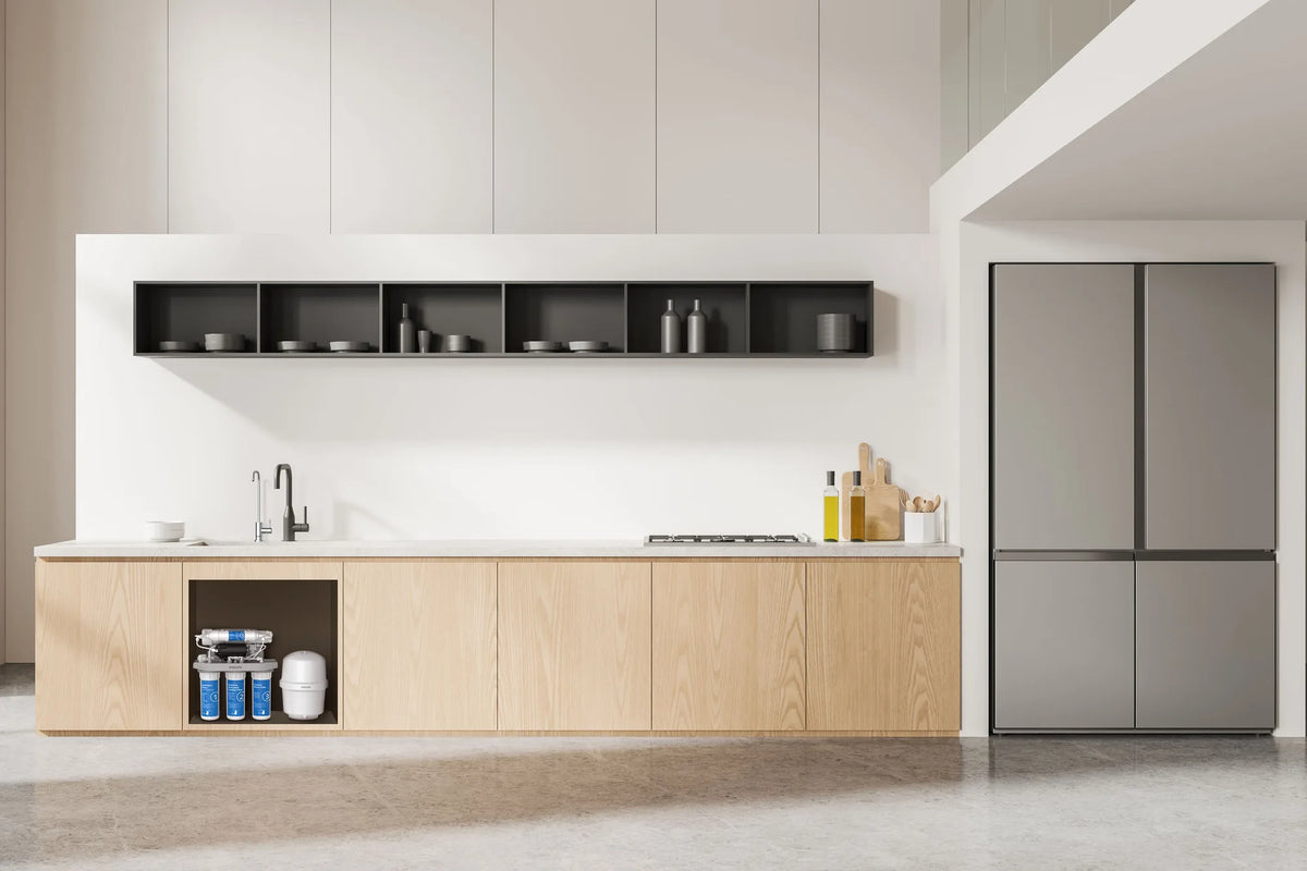 Wide view of Philips AUT9510 6-stage RO water purifier installed under a modern kitchen sink cabinet