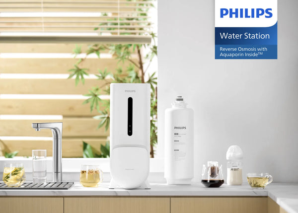Philips AUT6104 brushed nickel 7-temperature RO tap set on a kitchen countertop in a branded lifestyle view.