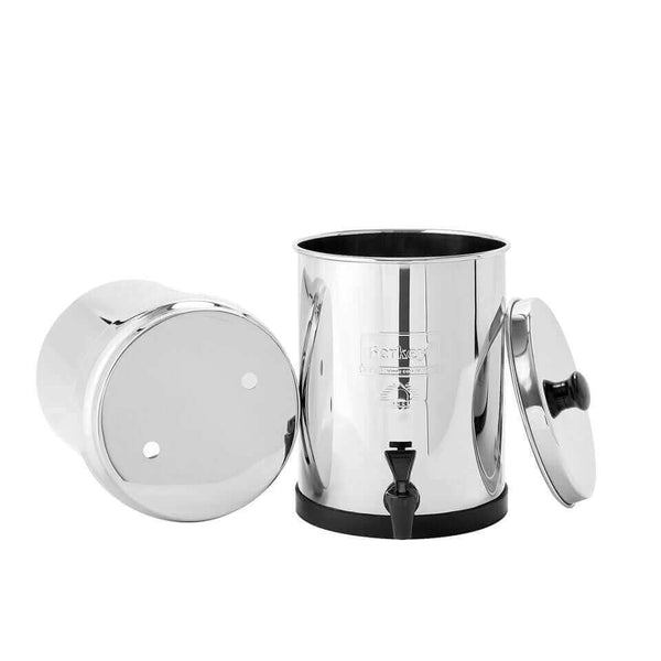 The Travel Berkey System (1.5 gal) by Berkey is a shiny metal water filter with a lid, spigot, and detachable top section.