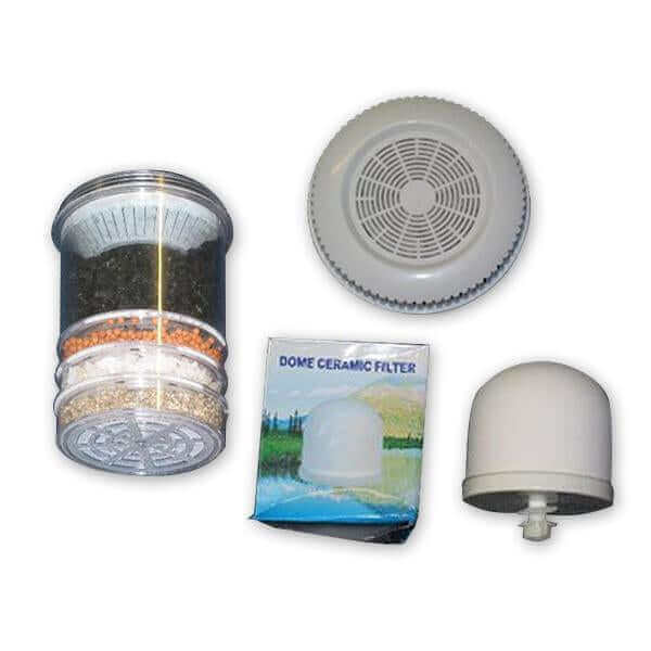 Replacement Cartridge Pack for the 6 Stage Multi Use pH Elevation Benchtop Gravity Water Filter featuring a dome ceramic filter and its box, the multi media filter, and a mineral pad. This system provides efficient multi-stage purification and is perfectly packaged for your convenience.