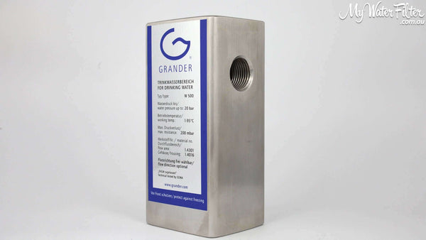 A durable, stainless steel Grander Whole House Unit showing the threaded connection on its side. This is a component of AquaCo Classic Triple Stage Whole House Water Filter with Grander Revitalisation.