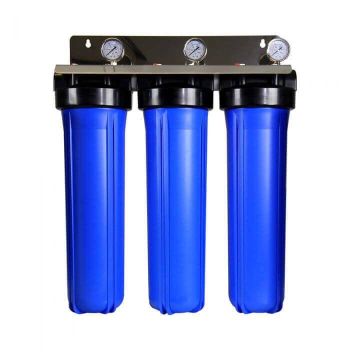 A whole house water filter system with three blue cylindrical filter housings and a black stainless steel bracket with gauges.