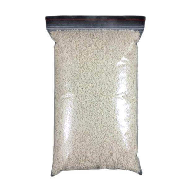 A clear plastic bag filled with white granules of Magnesium Oxide titled Corosex pH Elevation Media 22kg designed for water alkalizing.