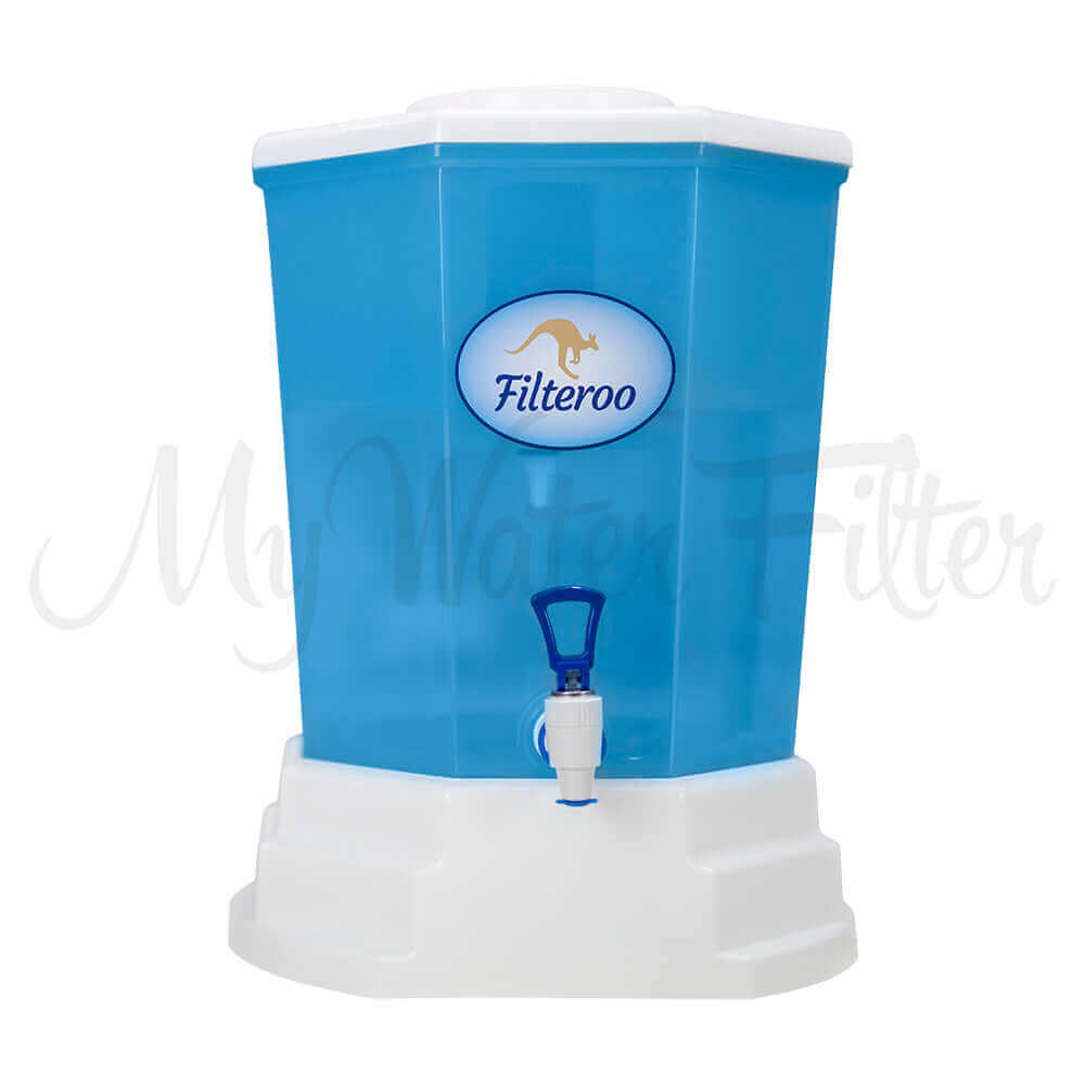 The Filteroo® Blue 20L Benchtop Gravity Water Filter, designed by Filteroo, is a stylish blue and white water filtration dispenser. It features a convenient tap at the bottom and proudly displays the Filteroo logo on the front. This gravity water filter guarantees clean and safe drinking water for your household.