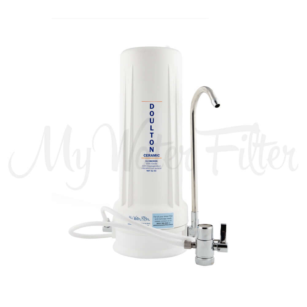 Doulton Ultracarb 0.5 Micron 10" Single Stage Ceramic Benchtop Water Filter in white with curved metal spout and attached hose.