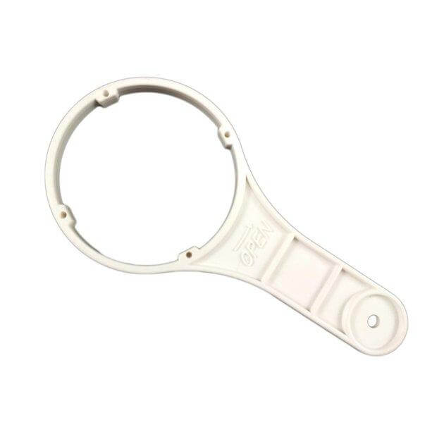 Reverse Osmosis Membrane Housing Opening Tool, a white plastic wrench featuring a circular opening and handle.